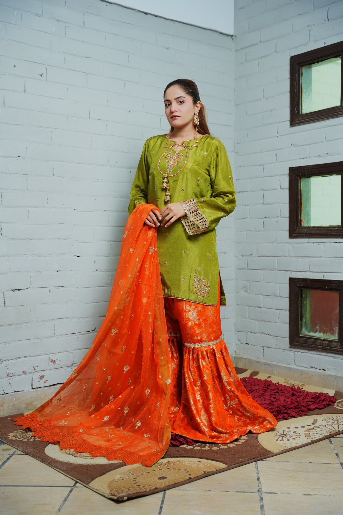 Green tassel silk shirt, orange Banarsi gharara and orange organza dupatta — view 1