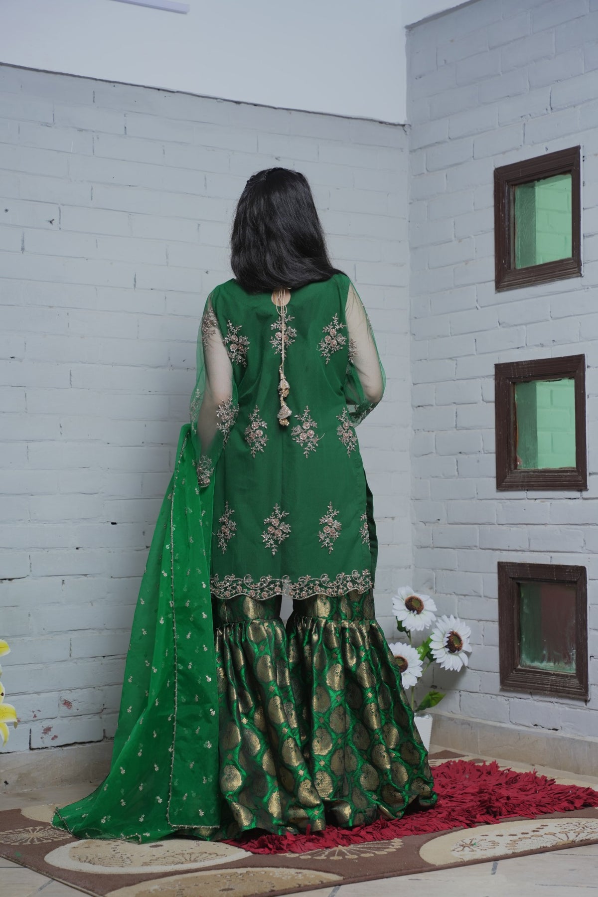 Back view of green embroidered shirt and gharara