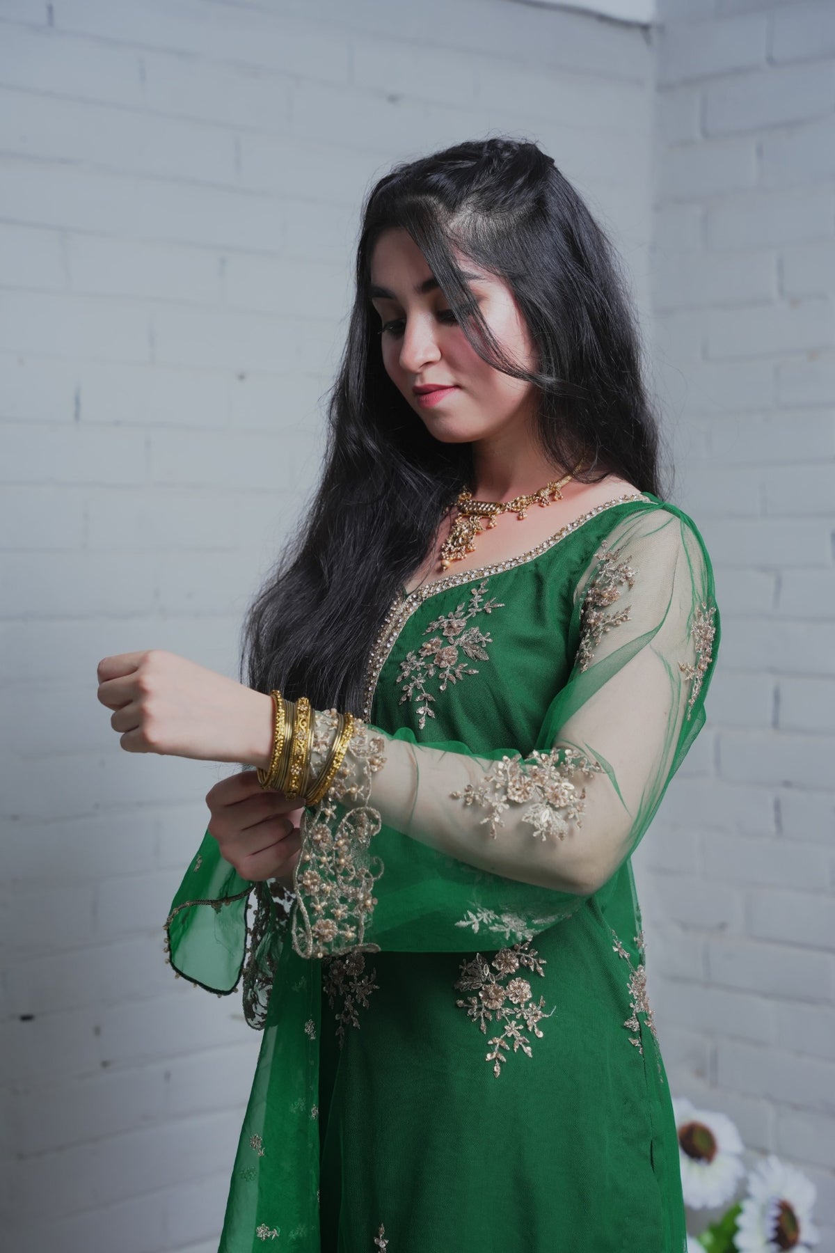 Close view of neckline embroidery and net sleeve