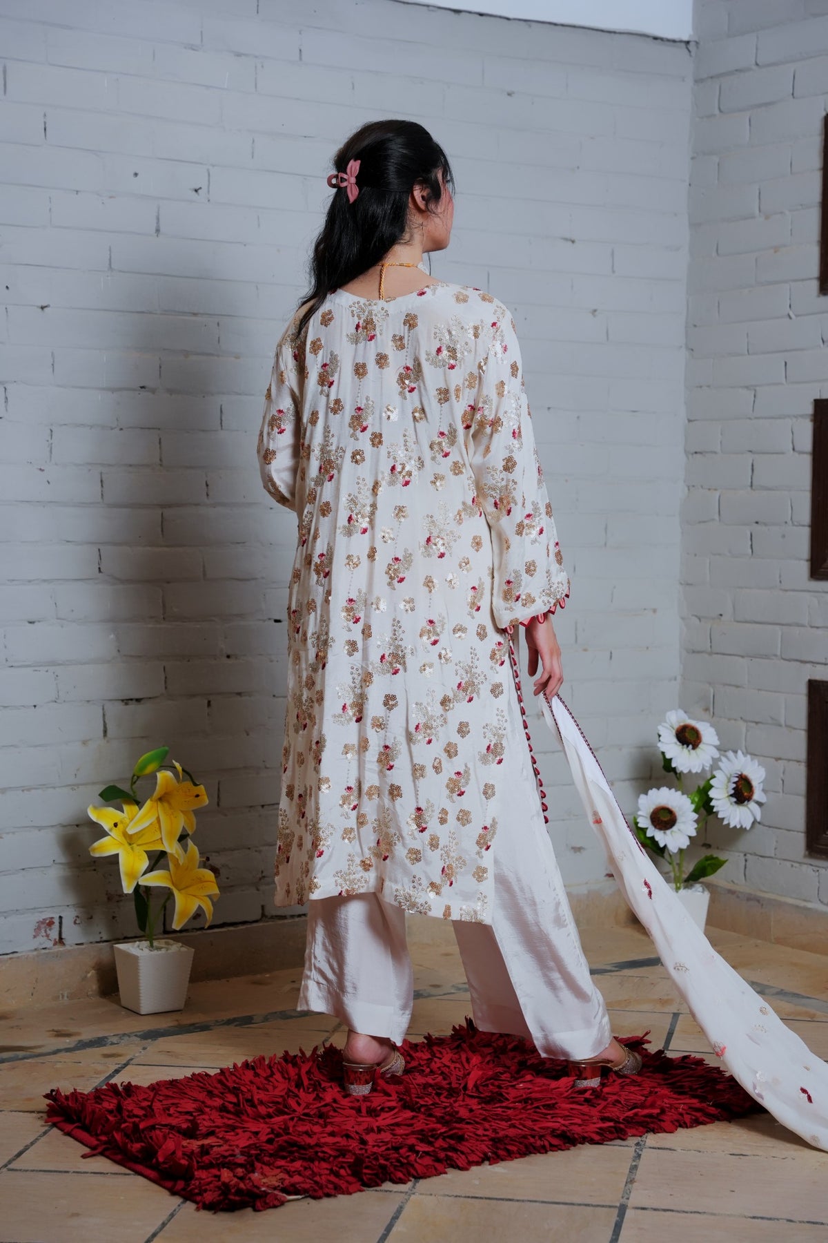 White and red embroidered suit — back view