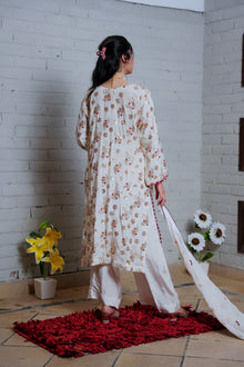 White and red embroidered suit — back view