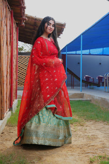 Fizza red and ferozi Banarsi lehenga set — side view