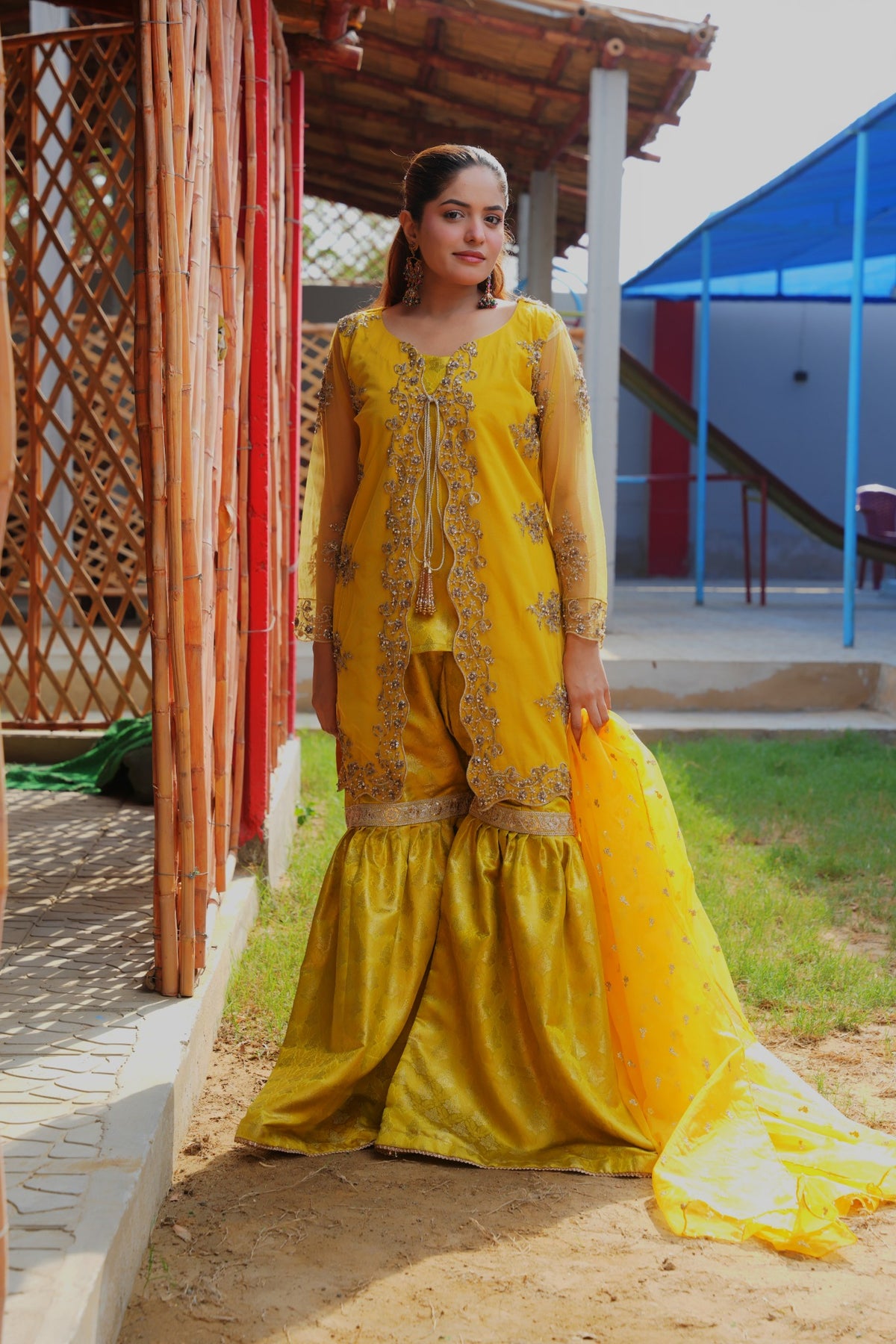 Urooj yellow net gown and Banarsi gharara set — full front